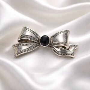 Silver Tone Bow Brooch with Black Center